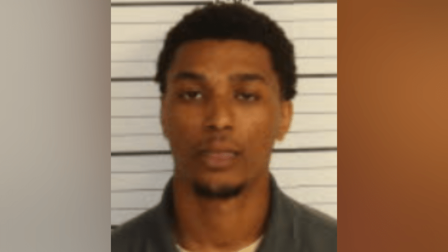 Stolen firearm found in domestic assault suspect's backpack at 201 Poplar